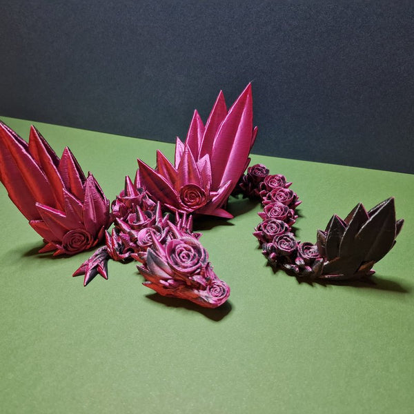 Articulated Rosyra rose dragon model in pink and black shown in full