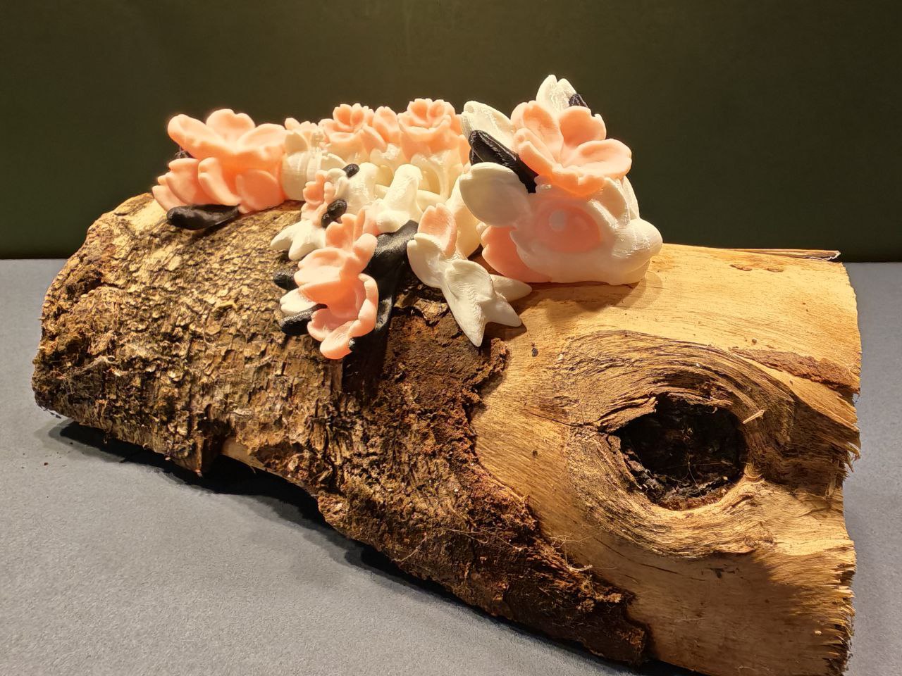 Floreth — cherry blossom dragon on a mossy log, hand-finished 3D print